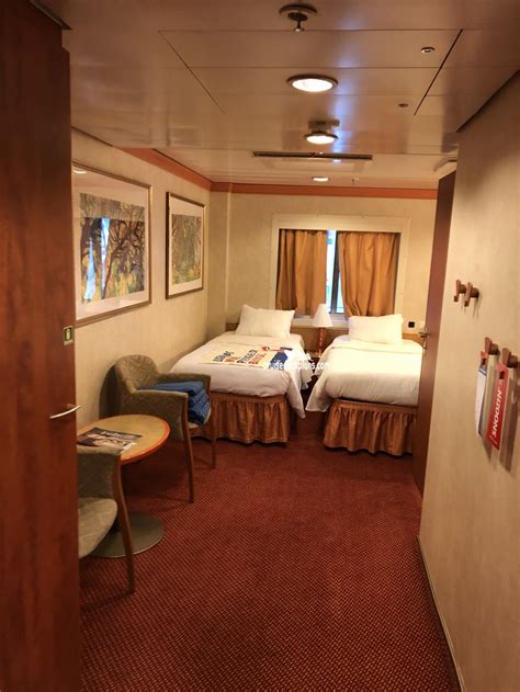 Unwinding in Style: Your Interior Stateroom for 4 on the Carnival Magic